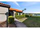 Well-maintained community building exterior with manicured landscaping and signage near community pool at 4209 Woodstorks Walk Way # 1304, Lutz, FL 33558