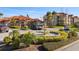 Well-maintained community area with a water fountain, lush landscaping, and beautiful building exteriors at 4209 Woodstorks Walk Way # 1304, Lutz, FL 33558