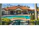 A lavish community pool with hot tub and ample seating with a well maintained clubhouse at 4209 Woodstorks Walk Way # 1304, Lutz, FL 33558