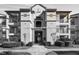 Well-maintained building featuring a covered balcony and manicured landscaping in a convenient location at 4209 Woodstorks Walk Way # 1304, Lutz, FL 33558