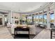 Elegant community lounge with a fireplace, TV, floor to ceiling windows overlooking outdoor area and ample seating at 4209 Woodstorks Walk Way # 1304, Lutz, FL 33558