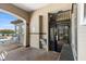 Covered pool entrance with secure access and seating area, offering residents a comfortable and safe experience at 4209 Woodstorks Walk Way # 1304, Lutz, FL 33558