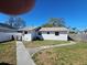 The house features a small green yard with a walkway and fenced yard at 4501 67Th N St, St Petersburg, FL 33709