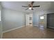 Bedroom with tile floors, a ceiling fan, and mirrored closet at 4501 67Th N St, St Petersburg, FL 33709