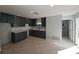 Spacious kitchen featuring dark green cabinets, white subway tile backsplash, and light countertops at 4501 67Th N St, St Petersburg, FL 33709