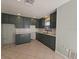 Open kitchen area offering ample counter space with dark green cabinets and modern fixtures at 4501 67Th N St, St Petersburg, FL 33709
