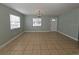 Bright living room with tile flooring and large windows offering ample natural light at 4501 67Th N St, St Petersburg, FL 33709