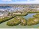 An aerial shot of a serene nature park surrounded by water featuring lush green vegetation at 4727 17Th S Ave, Gulfport, FL 33711