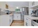 Contemporary kitchen featuring white cabinets, stainless steel appliances, and modern finishes at 4727 17Th S Ave, Gulfport, FL 33711