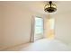 Bedroom with fan light fixture, neutral walls, carpet, and a window with curtains at 521 Tuscanny Park Loop, Brandon, FL 33511