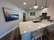 Modern kitchen featuring a quartz countertop island with bar stool seating and stainless steel appliances at 6100 Bahia Del Mar Cir # 102, St Petersburg, FL 33715