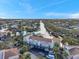 Aerial view showcases waterfront condos offering boat parking and serene water views under a blue sky at 6311 Newtown Cir # 11B2, Tampa, FL 33615