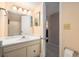 Bathroom featuring a vanity with sink, a large mirror, and a tiled floor at 6311 Newtown Cir # 11B2, Tampa, FL 33615