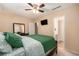 Comfortable bedroom with ceiling fan, TV, and ensuite bathroom at 6311 Newtown Cir # 11B2, Tampa, FL 33615