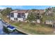 Rear exterior shows screened condo lanais facing the water with boat parking available and mature landscaping at 6311 Newtown Cir # 11B2, Tampa, FL 33615