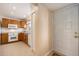 Inviting kitchen featuring tile floors, wood cabinets, and white appliances at 6311 Newtown Cir # 11B2, Tampa, FL 33615
