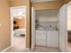 Hallway laundry closet with a washing machine and dryer at 6311 Newtown Cir # 11B2, Tampa, FL 33615