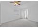 Comfortable bedroom with carpet flooring, a ceiling fan, and a window with natural light at 6935 Dimarco Rd, Tampa, FL 33634