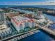 Beautiful aerial view of condominium complex with a pool and boat docks along the water at 700 S Harbour Island Blvd # 204, Tampa, FL 33602