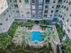 Elevated shot highlights the pool and spa, nestled among lush landscaping, with views of the building at 700 S Harbour Island Blvd # 204, Tampa, FL 33602