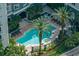Stunning aerial view showcasing the pool and spa, surrounded by palm trees and landscaping at 700 S Harbour Island Blvd # 204, Tampa, FL 33602