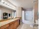 Bathroom with granite countertops, tiled floors, and bathtub with shower at 700 S Harbour Island Blvd # 204, Tampa, FL 33602