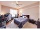 Cozy bedroom featuring a ceiling fan, a study corner, and natural light from a window at 700 S Harbour Island Blvd # 204, Tampa, FL 33602