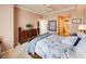 Bedroom featuring a queen bed, dresser, and view to bathroom at 700 S Harbour Island Blvd # 204, Tampa, FL 33602