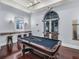 The billiards room provides a fun and relaxing space for residents to play pool with a window view at 700 S Harbour Island Blvd # 204, Tampa, FL 33602
