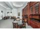 An entertainment area in the community clubhouse features elegant built-in cabinetry and round tables with seating at 700 S Harbour Island Blvd # 204, Tampa, FL 33602