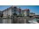 Beautiful waterfront condo building showcasing private boat slips, landscaping, and architectural details at 700 S Harbour Island Blvd # 204, Tampa, FL 33602