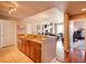 Open kitchen with granite countertops and wood cabinets leads to the living area at 700 S Harbour Island Blvd # 204, Tampa, FL 33602
