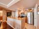Spacious kitchen boasts stainless steel appliances and a granite countertop breakfast bar at 700 S Harbour Island Blvd # 204, Tampa, FL 33602
