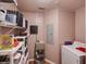 Well-organized laundry room featuring ample storage shelves and a washing machine at 700 S Harbour Island Blvd # 204, Tampa, FL 33602