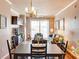 Bright living room with a dining table and sliding glass doors to the balcony at 700 S Harbour Island Blvd # 204, Tampa, FL 33602