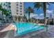 Sparkling pool with palm trees offers a refreshing escape and a picturesque view of the building at 700 S Harbour Island Blvd # 204, Tampa, FL 33602