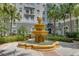 Multi-tiered fountain surrounded by mature landscaping offering a peaceful courtyard for residents at 700 S Harbour Island Blvd # 204, Tampa, FL 33602