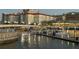 Picturesque view of waterfront condos, a lit walkway, boats, and inviting water reflections at 700 S Harbour Island Blvd # 204, Tampa, FL 33602