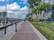 Scenic waterfront walkway with palm trees, flowers, and convenient boat docks, a relaxing space for residents at 700 S Harbour Island Blvd # 204, Tampa, FL 33602