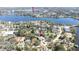 Neighborhood aerial view near a large lake, showcasing spacious lots and mature trees at 733 Seminole Blvd, Tarpon Springs, FL 34689