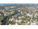 Expansive aerial view of a waterfront community with lush greenery and beautiful waterfront homes at 733 Seminole Blvd, Tarpon Springs, FL 34689