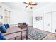 Bedroom featuring a ceiling fan, wood floors, and a comfortable sitting area at 733 Seminole Blvd, Tarpon Springs, FL 34689