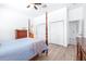 Bright bedroom features a four poster bed, ensuite bathroom, and large wardrobe at 733 Seminole Blvd, Tarpon Springs, FL 34689