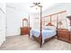 This bright bedroom is nicely decorated with wood furnishings and plenty of natural light at 733 Seminole Blvd, Tarpon Springs, FL 34689