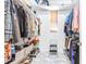 A well-organized walk-in closet with shelving and storage for clothes and shoes at 733 Seminole Blvd, Tarpon Springs, FL 34689