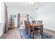 Bright dining room featuring a wood table set and French doors with backyard views at 733 Seminole Blvd, Tarpon Springs, FL 34689