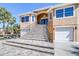 Beautiful home with a grand staircase, double-door entry, and attached garages at 733 Seminole Blvd, Tarpon Springs, FL 34689
