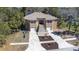 View of the house from the front yard featuring a dual-car garage at 733 Seminole Blvd, Tarpon Springs, FL 34689