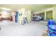 Spacious garage perfect for multiple cars, workshop, or storage with unique lighting at 733 Seminole Blvd, Tarpon Springs, FL 34689