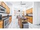 Bright kitchen with stainless steel appliances, wooden cabinets, and center island at 733 Seminole Blvd, Tarpon Springs, FL 34689